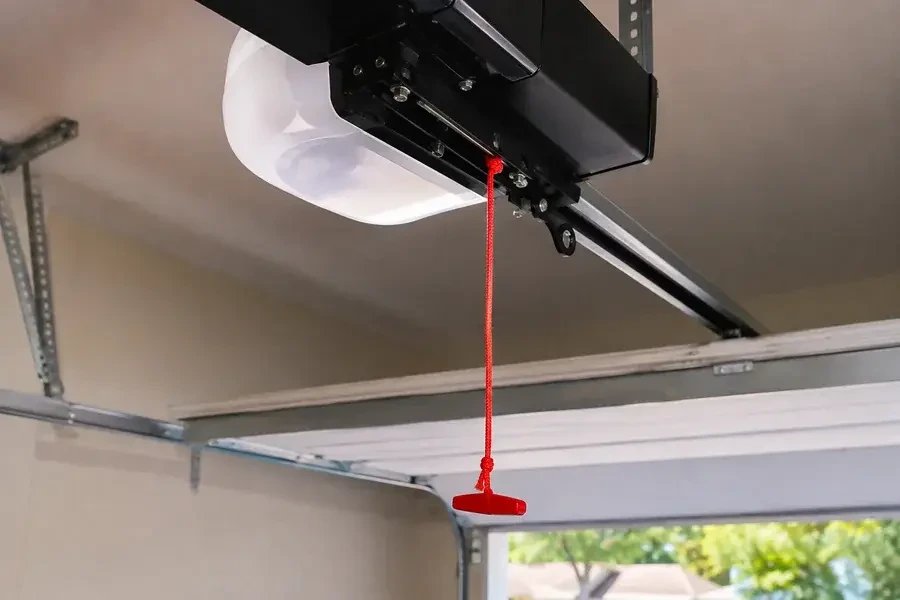 Garage door emergency release cord on an opener trolley in Palm Coast, FL, from Palm Coast Garage Door Co.