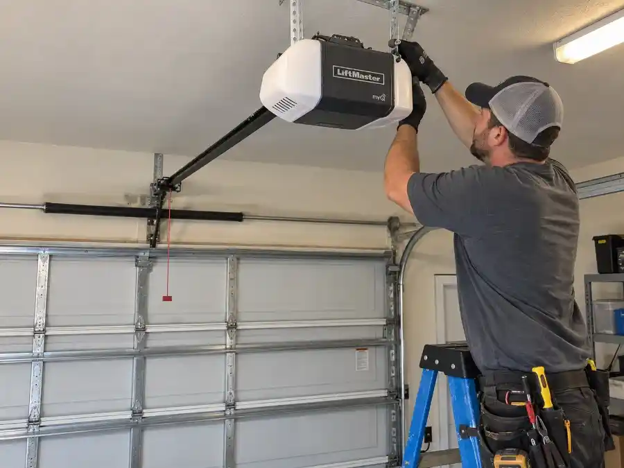 Garage Door Repair Cost in Palm Coast, FL 2 LiftMaster garage door opener being installed on the ceiling track system of a Palm Coast FL residential garage in Flagler County