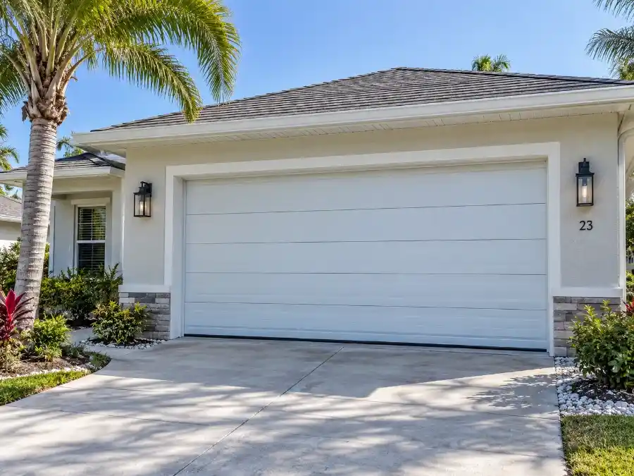 Hurricane-rated aluminum garage door on a Palm Coast FL home showing contemporary panel design and impact-rated hardware
