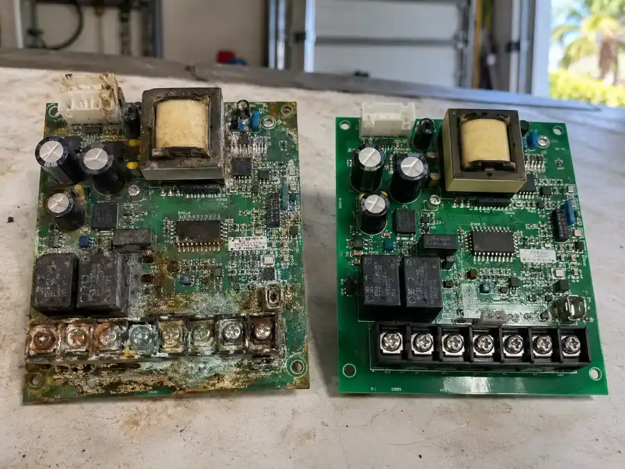 Garage Door Opener Repair & Installation in Palm Coast, FL 3 Corroded garage door opener circuit board showing humidity and salt-air damage in Palm Coast, FL, with a clean replacement board beside it